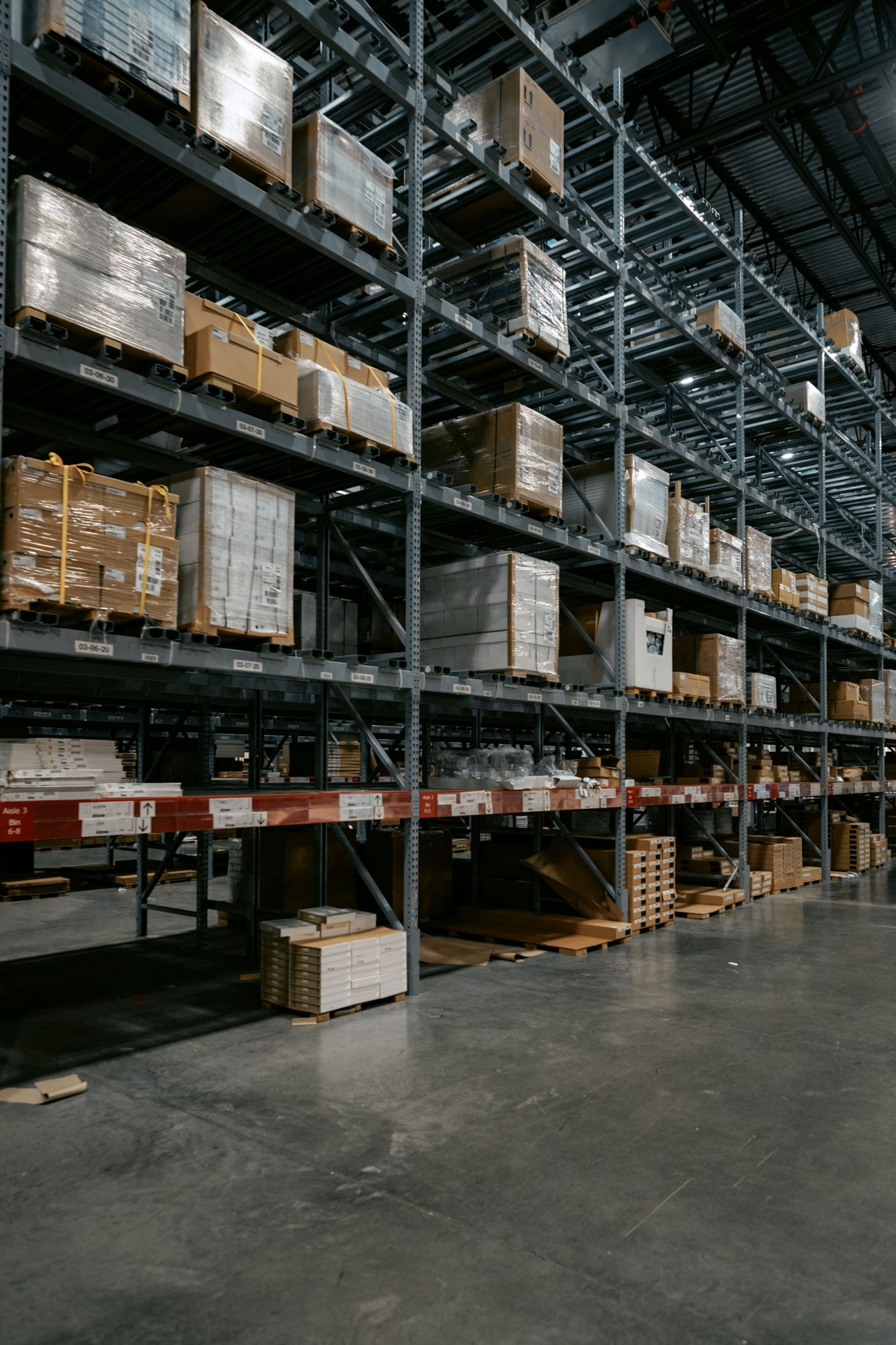 Inventory on tall storage racks inside a warehouse